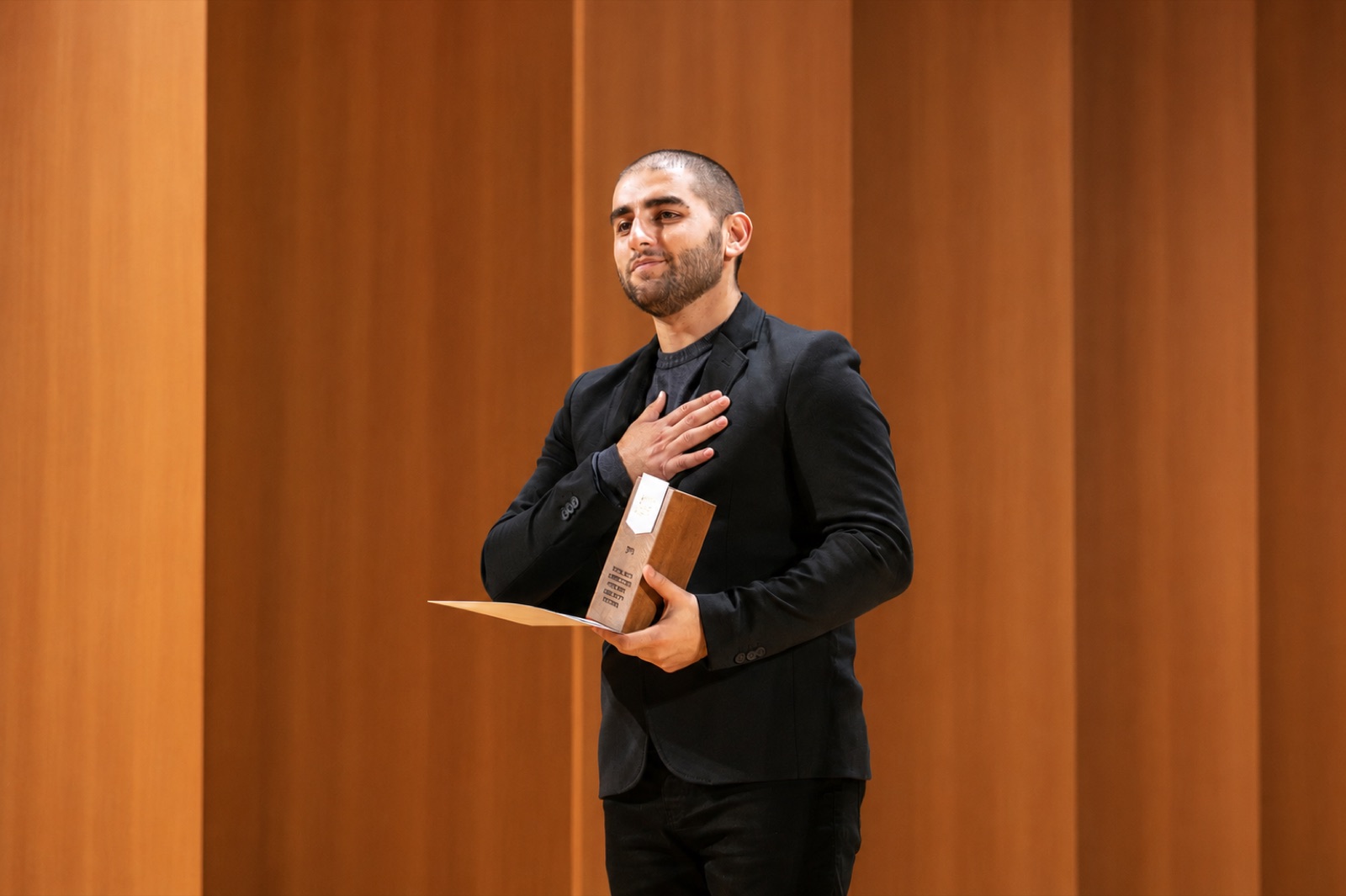 Nika Zaridze receiving an award on stage